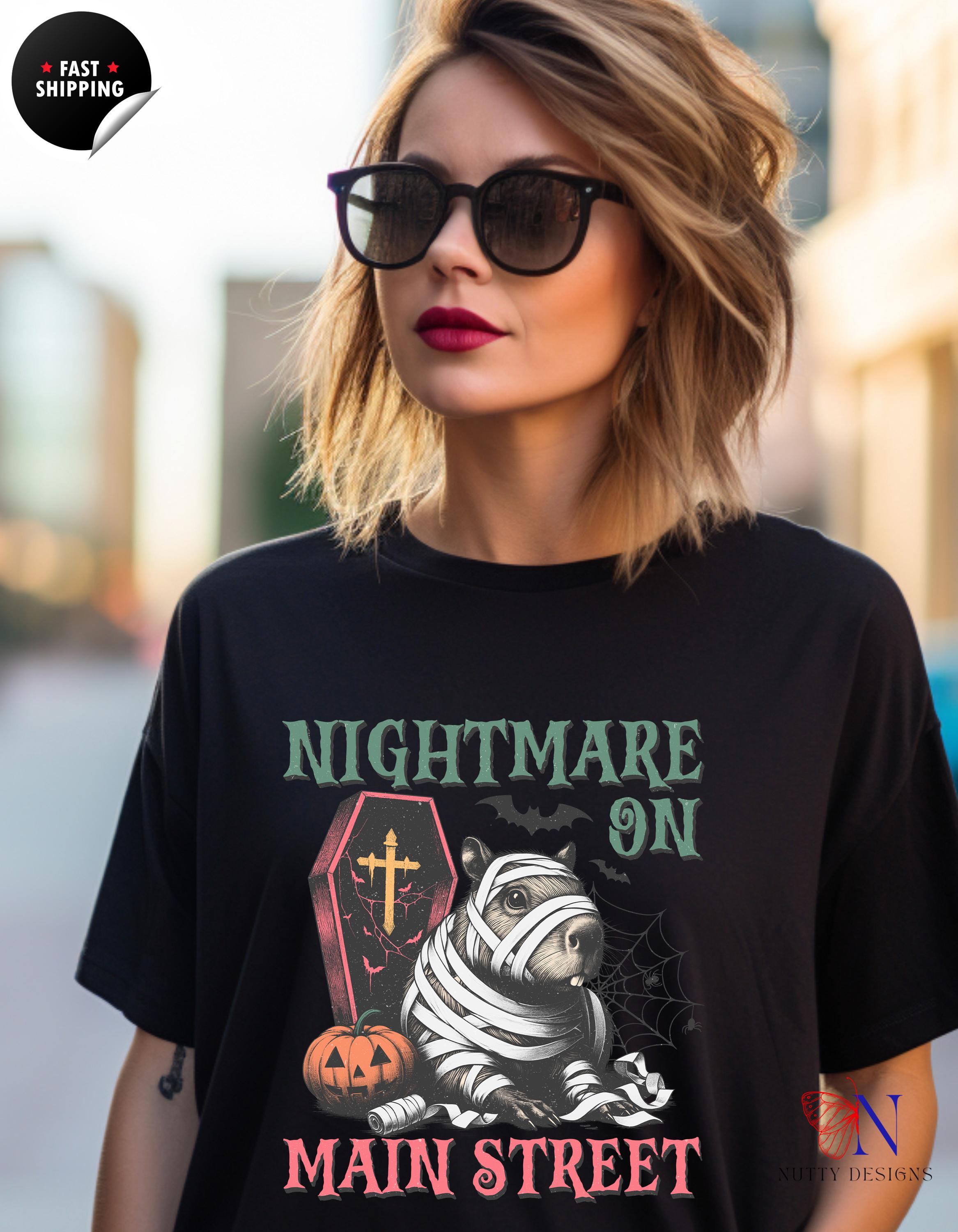 Nightmare-on-Main-Street Capybara Mummy Halloween T-shirt, Cute Halloween Tee, Spooky Gifts for Animal Lovers, Seasonal Fall Autumn Tee