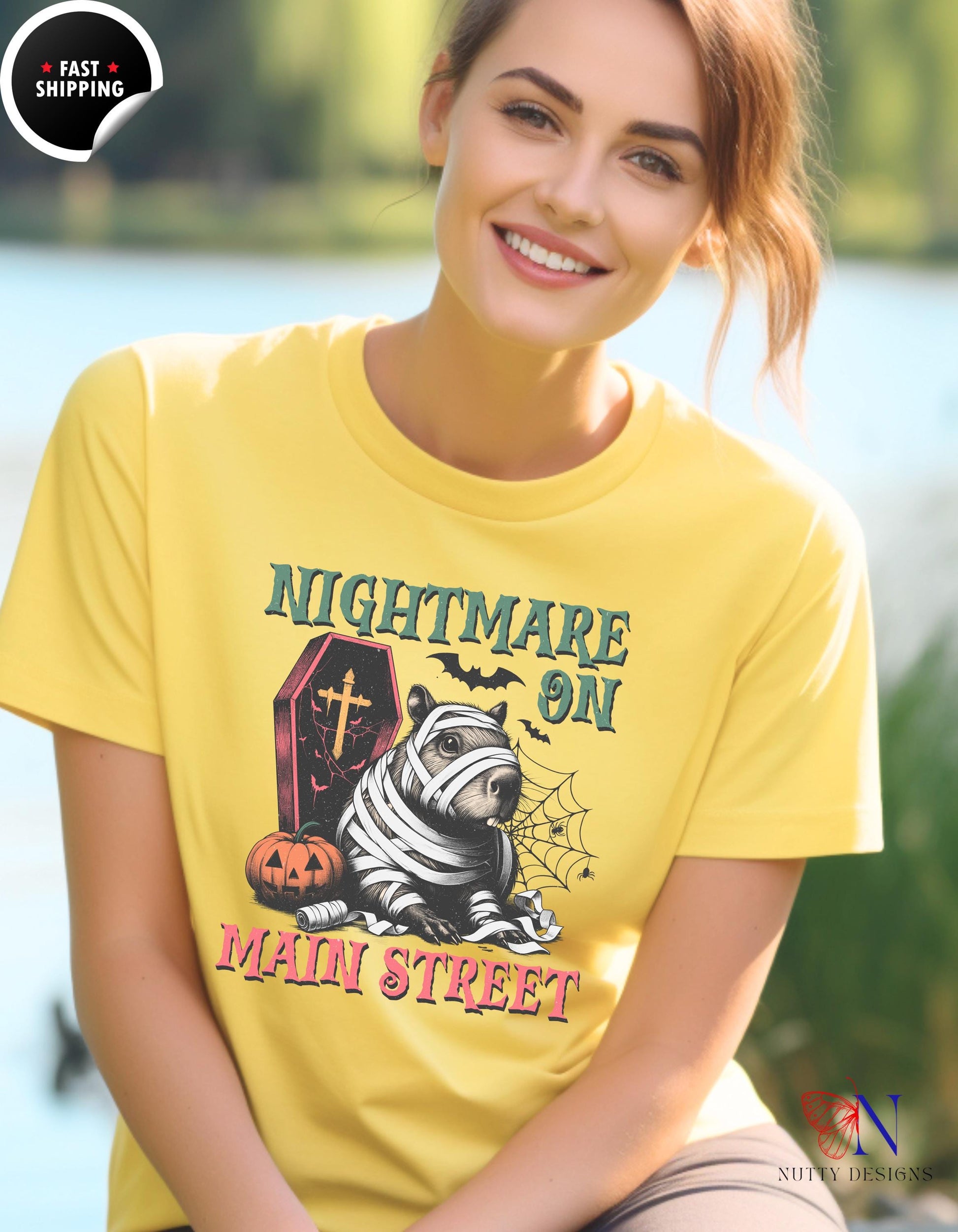 a woman wearing a yellow t - shirt with the words nightmares on it