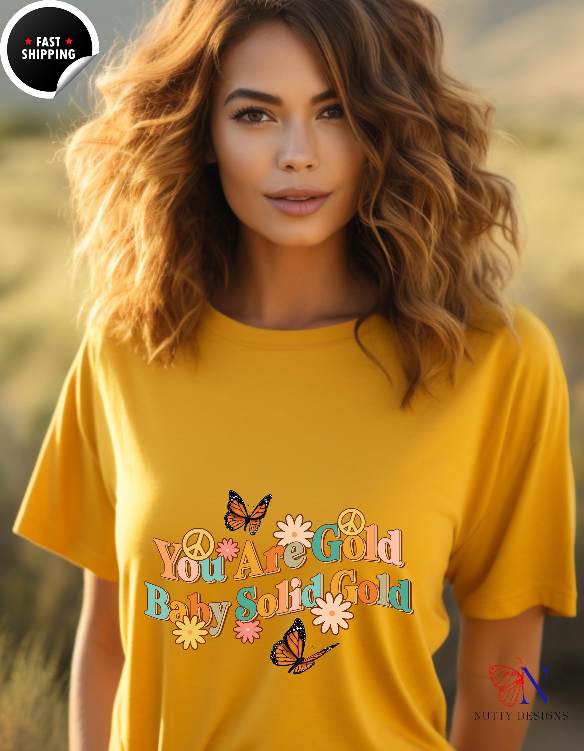 a woman wearing a yellow shirt with a butterfly on it