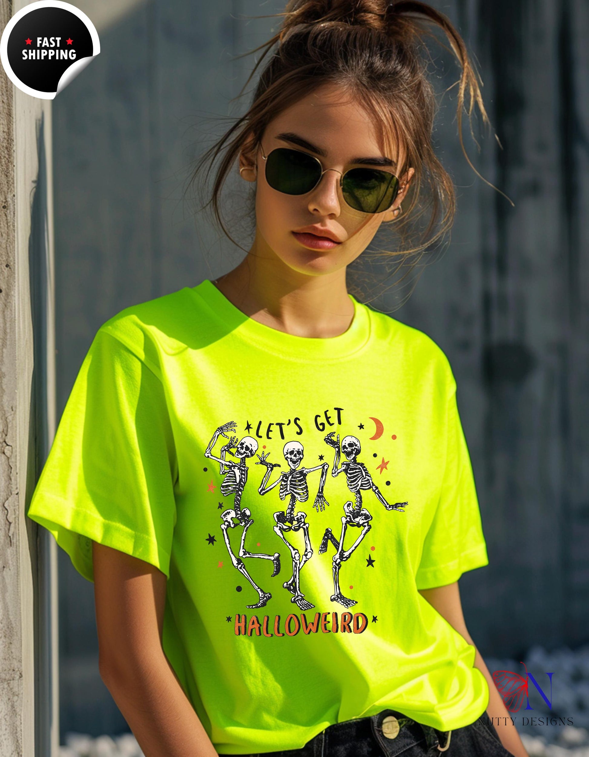 a woman wearing a neon yellow shirt with skeletons on it