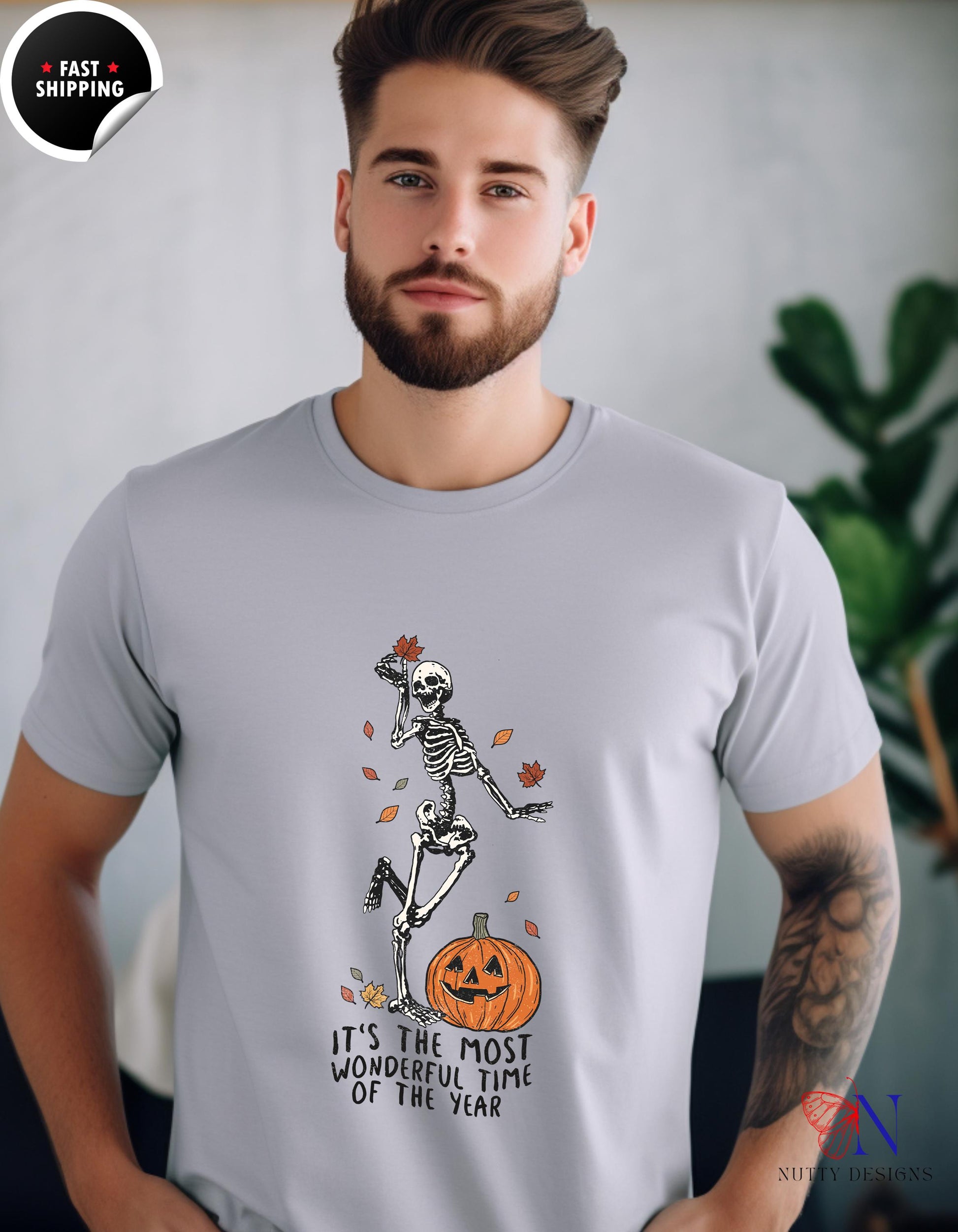 a man wearing a t - shirt with a skeleton on it