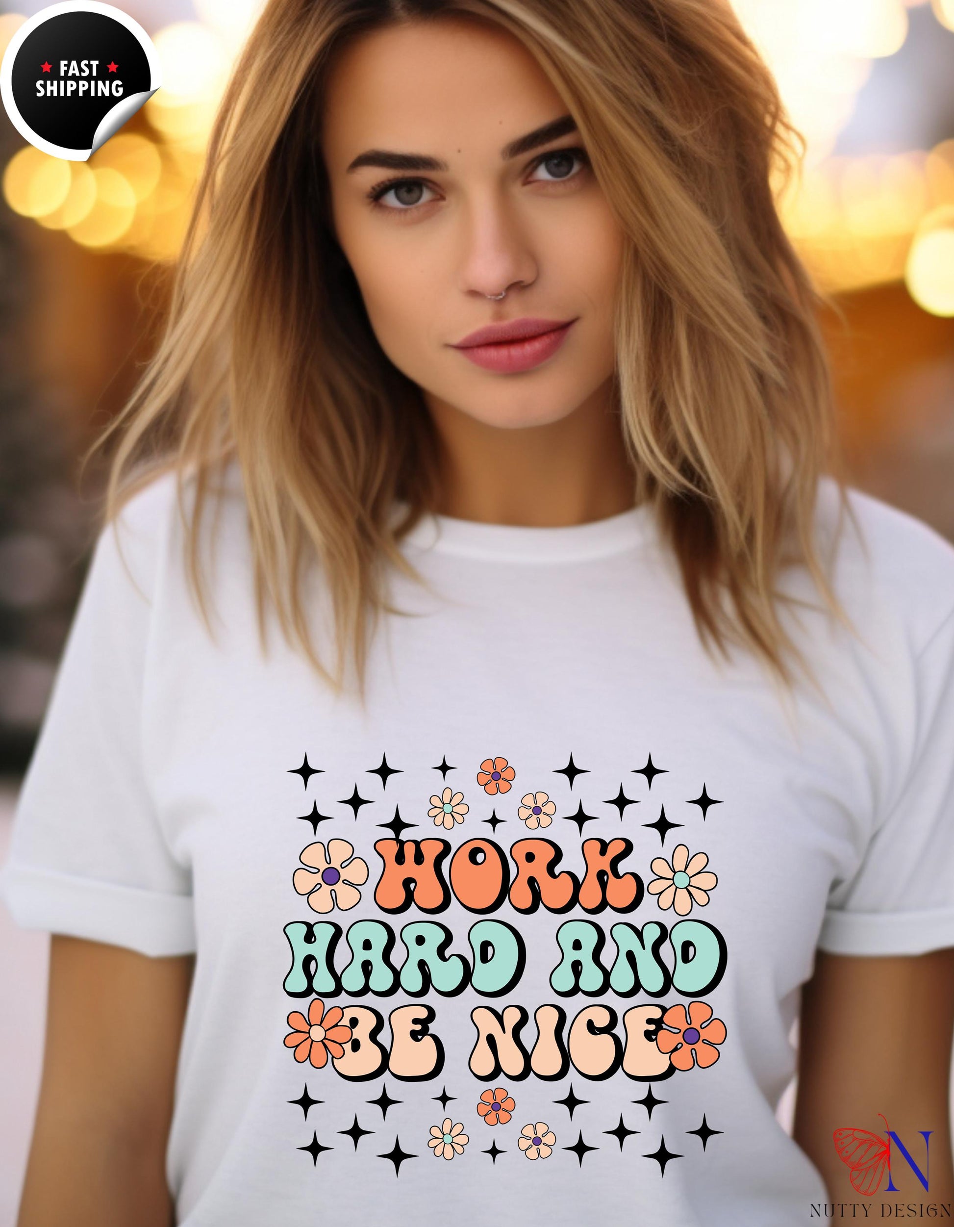 a woman wearing a t - shirt that says work hard and be nice