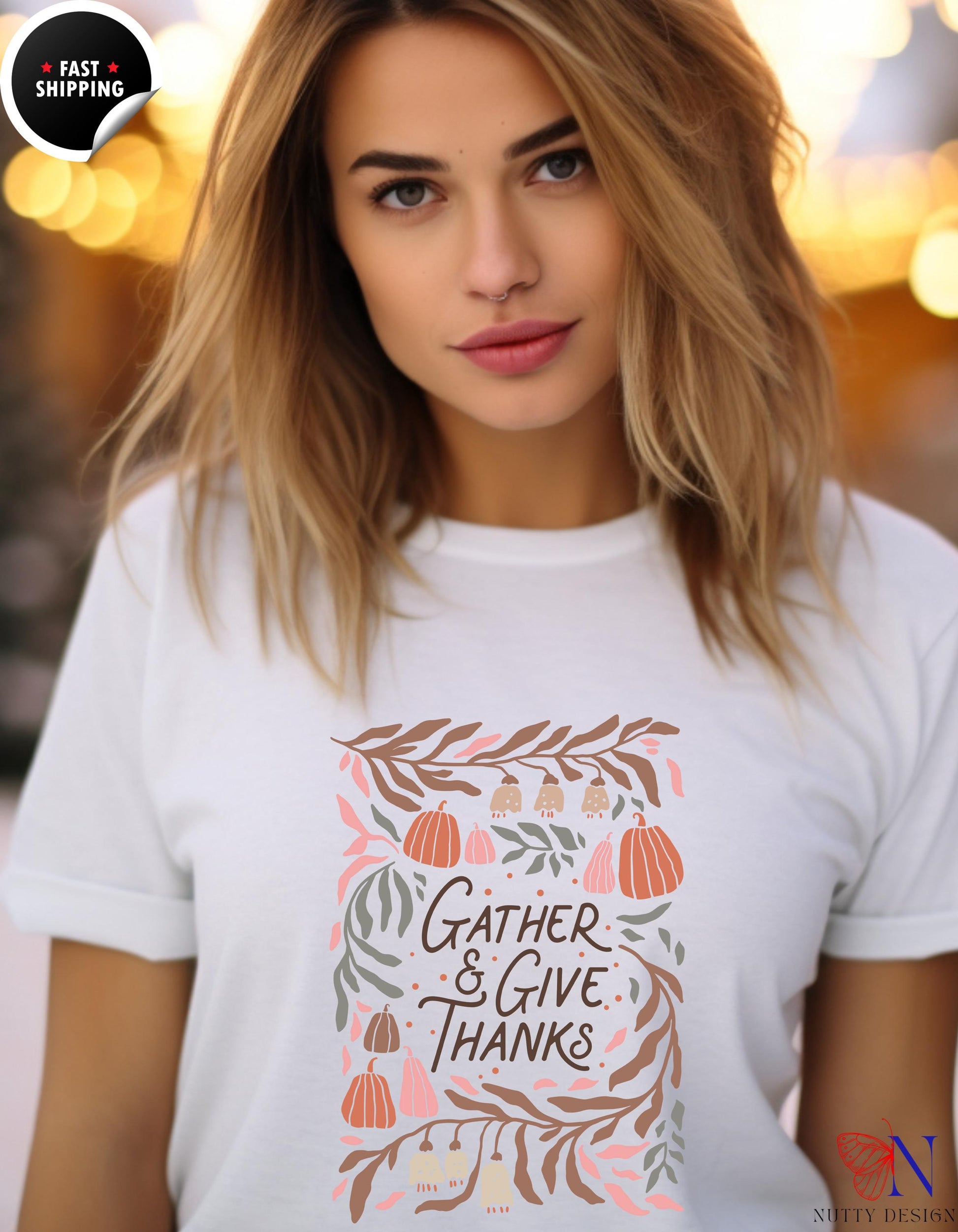 a woman wearing a t - shirt that says gather and give thanks