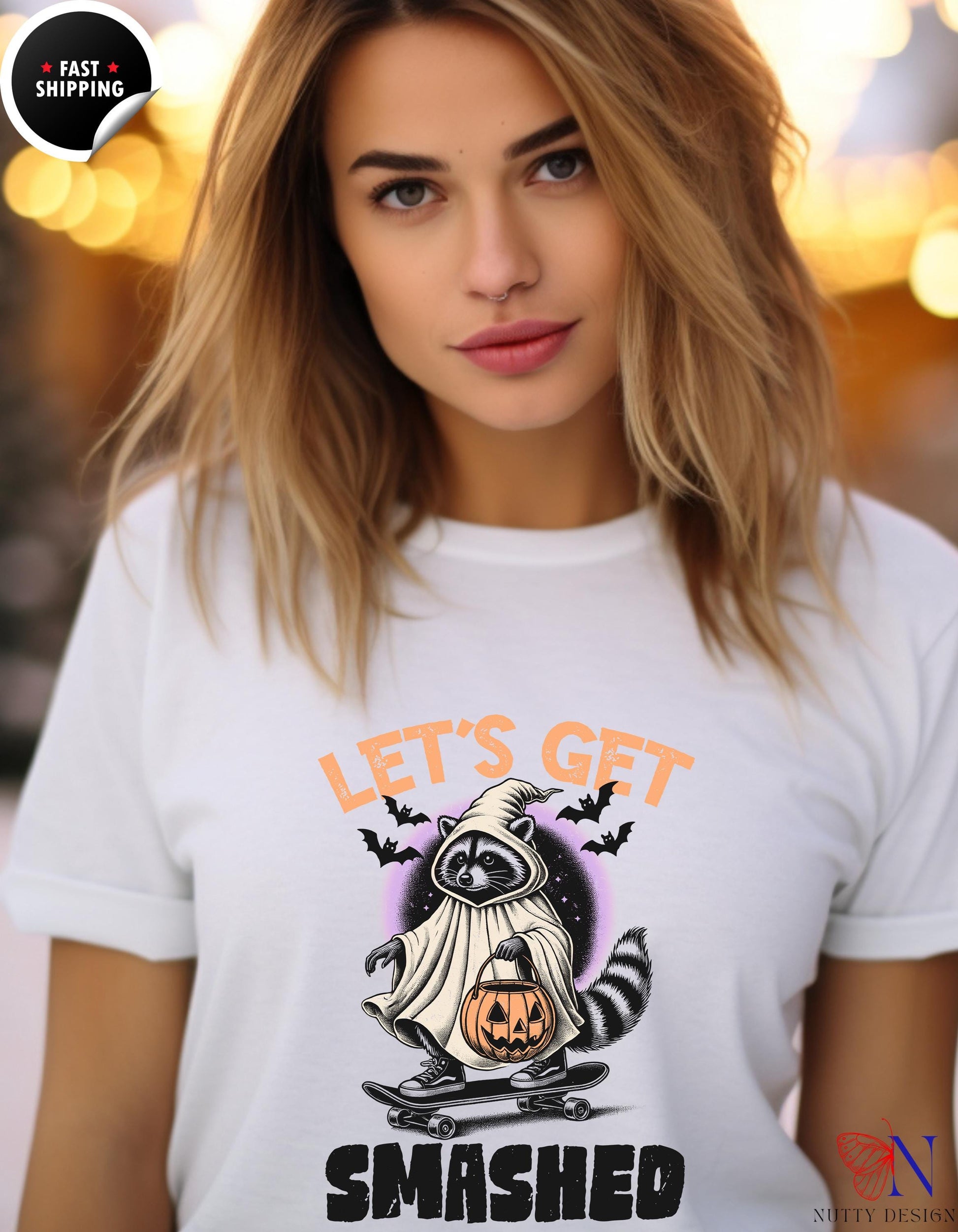 a woman wearing a t - shirt with a picture of a ghost on it