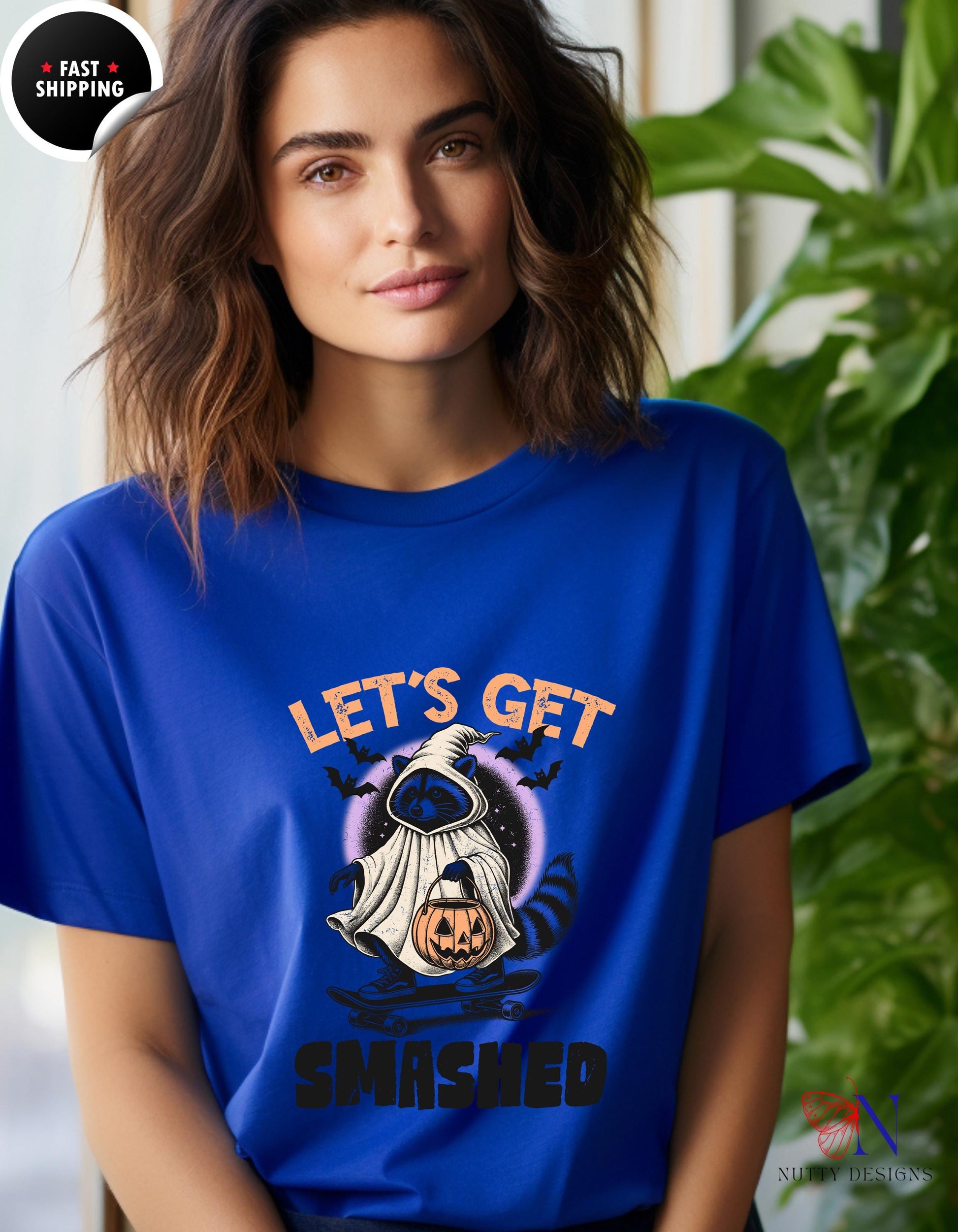 a woman wearing a blue t - shirt that says let&#39;s get smashed