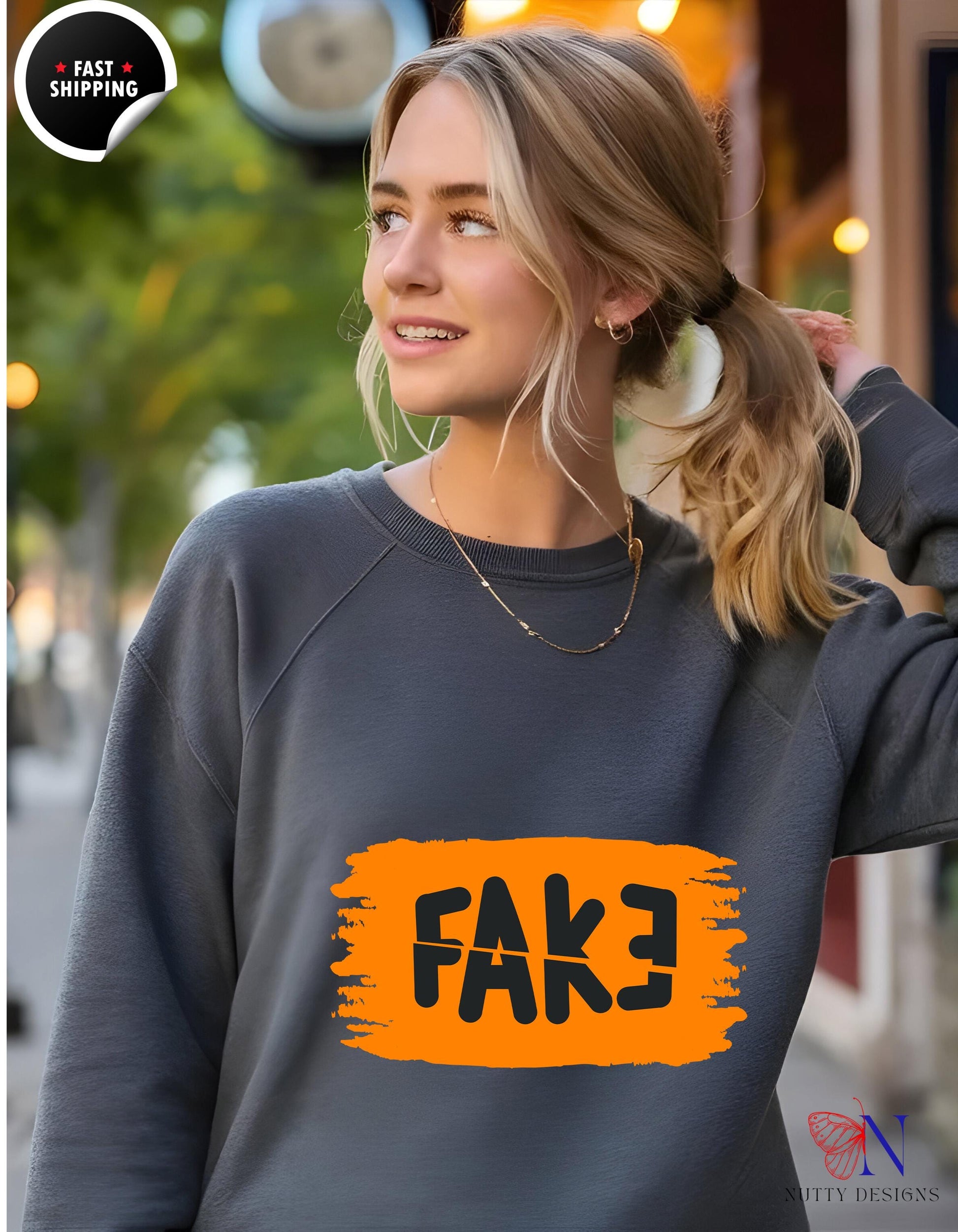 a woman wearing a sweatshirt with a fake fake fake fake fake fake fake fake fake