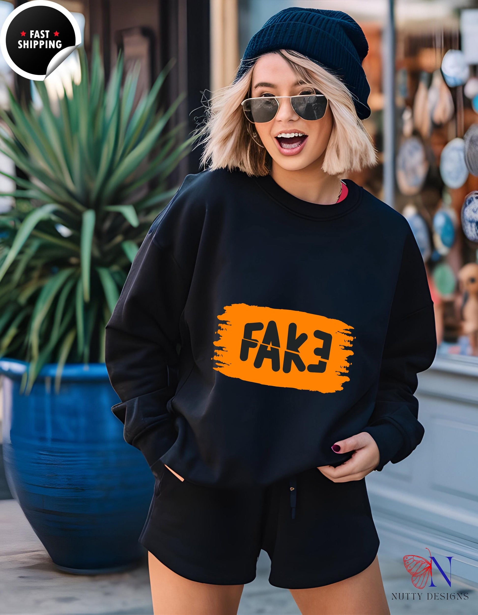 a woman wearing a black sweatshirt with a fake fake fake fake fake fake fake fake