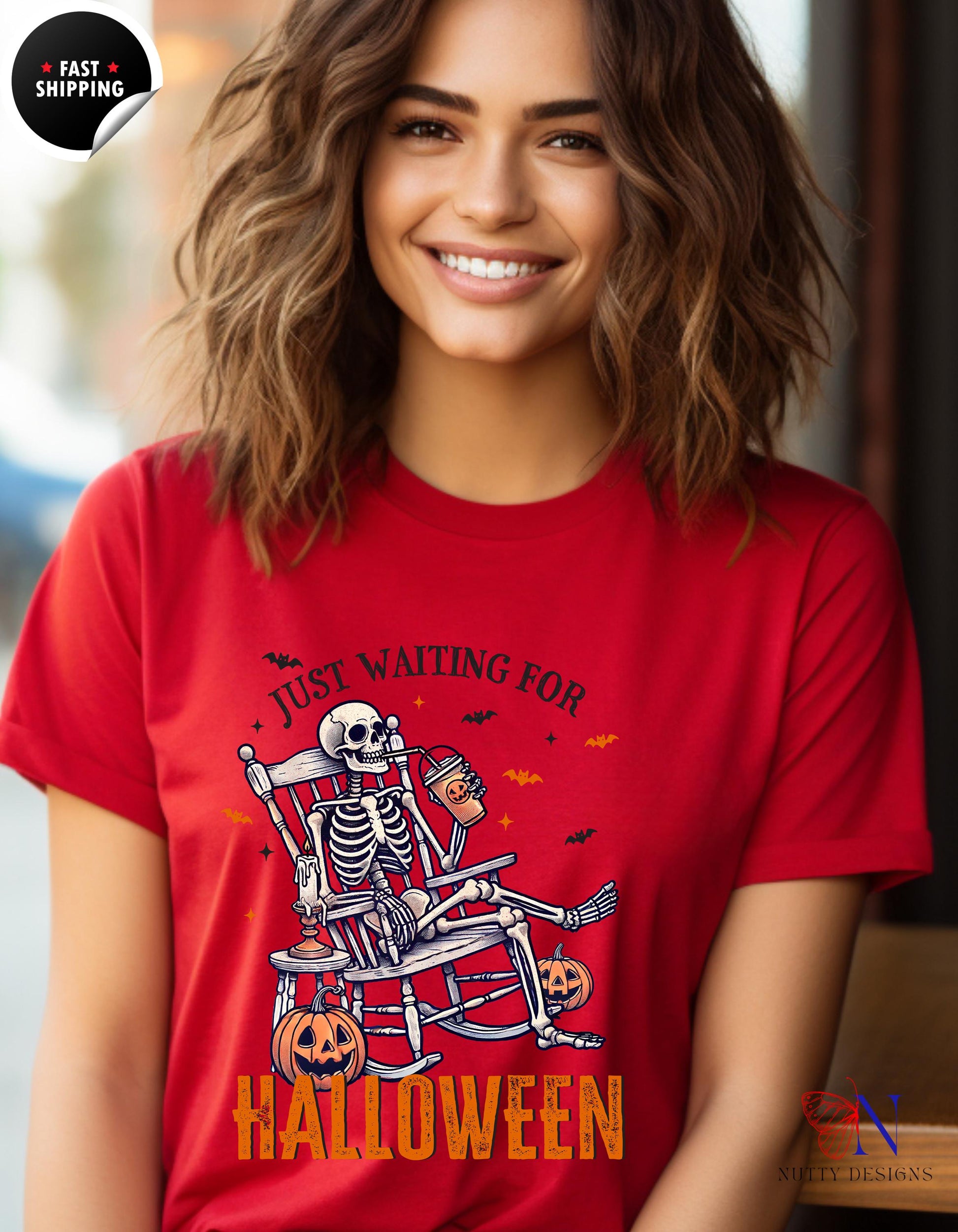 a woman wearing a red shirt with a skeleton on it