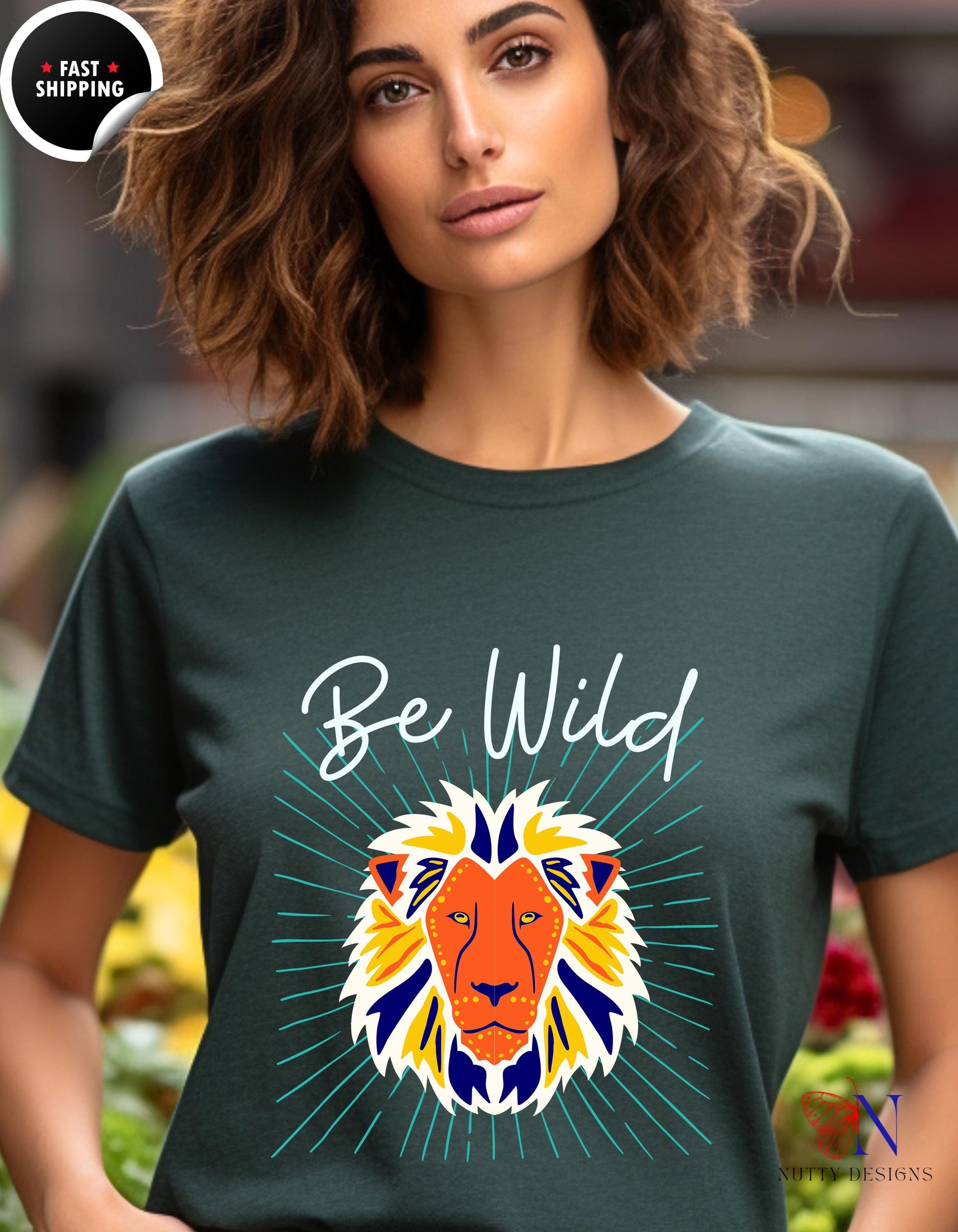 a woman wearing a t - shirt with a lion on it