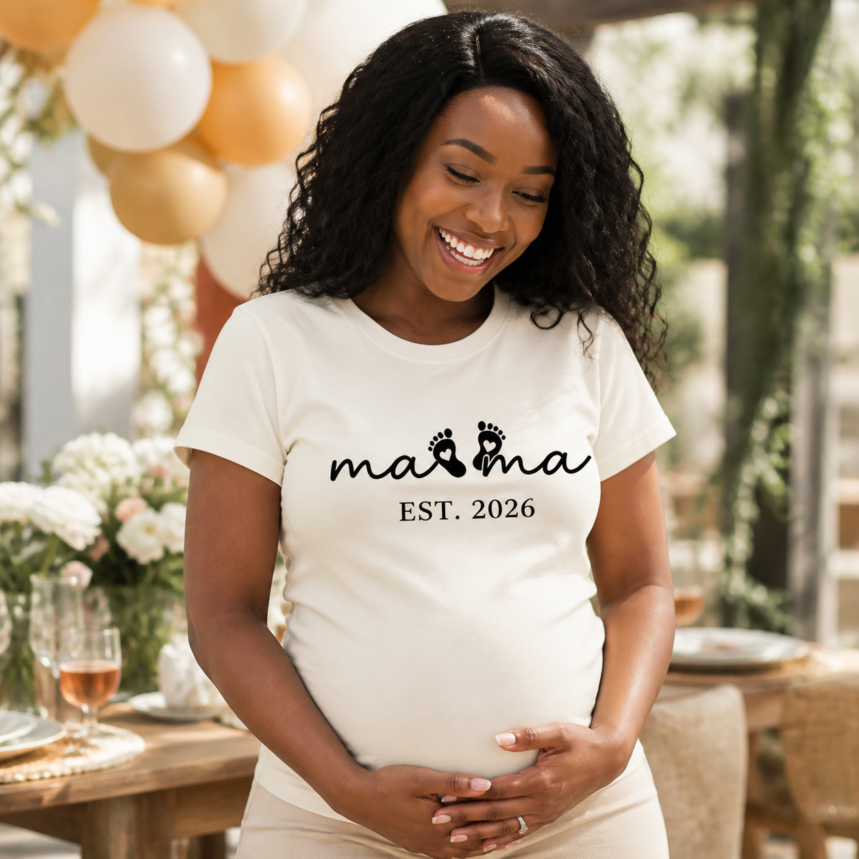 Mama Est. 2026 baby footprints maternity T-shirt lifestyle photo
