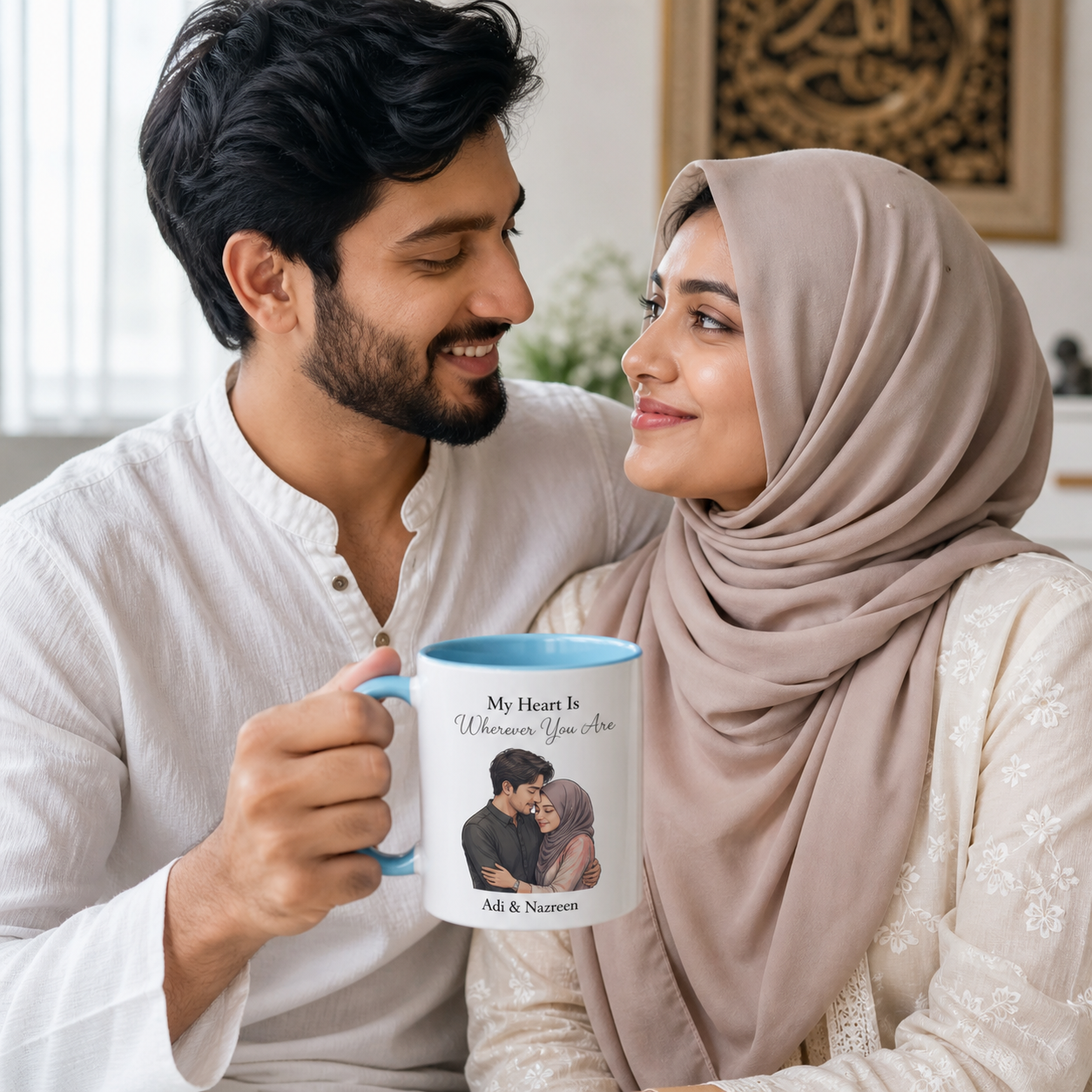 Young Muslim couple holding personalized blue-accent My Heart mug at home