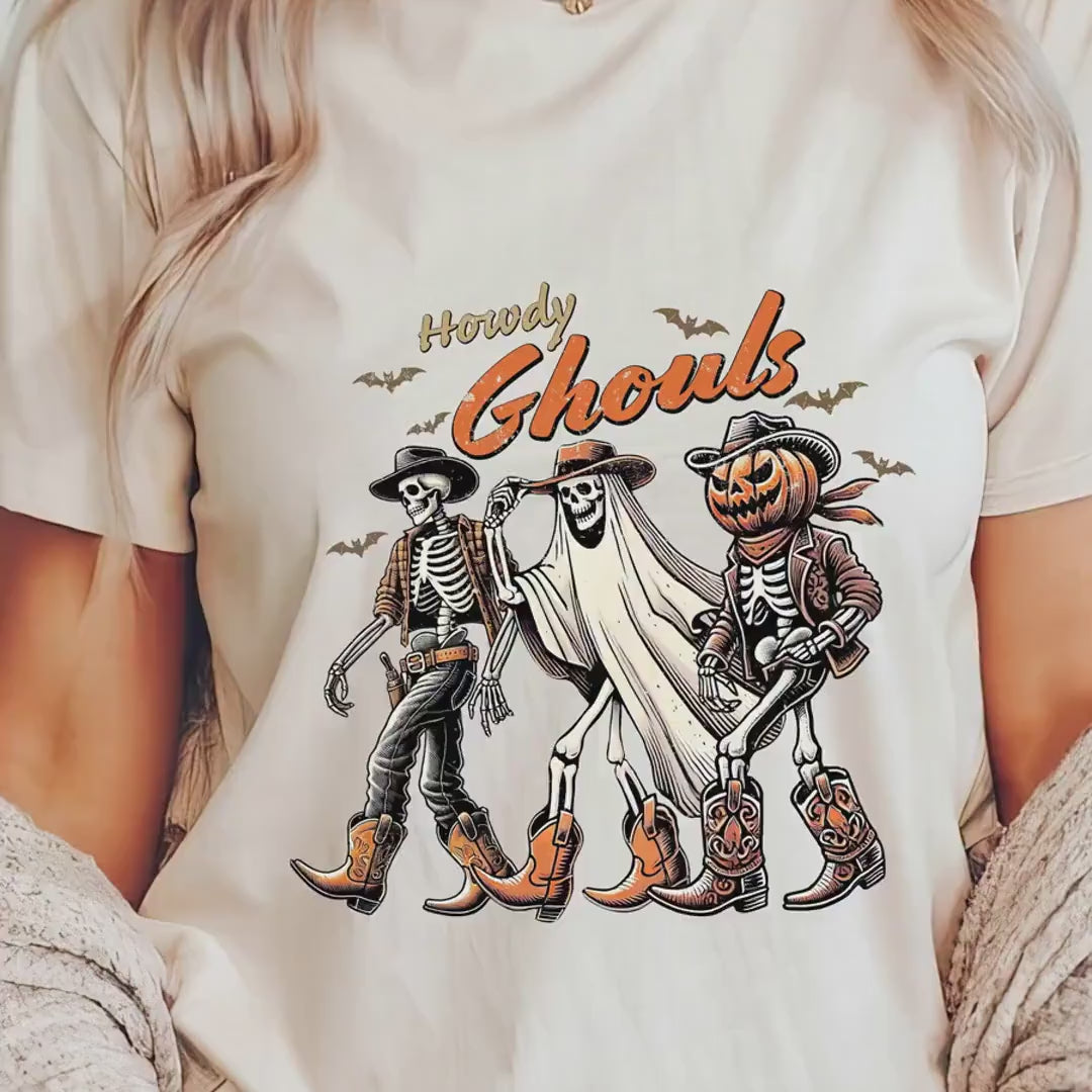 Load video: Howdy Ghouls Halloween T-shirt | Cute Cowboy Skeletons, Ghosts Tee | Spooky Festive Fall Autumn Tee for Kids &amp; Adults