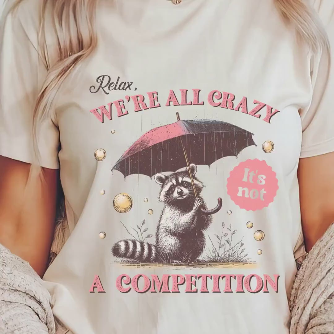 Load video: Relax We&#39;re All Crazy T-Shirt | Funny Racoon Graphic Tee | Humorous Quote Shirt | Casual Wear for Nature Lovers