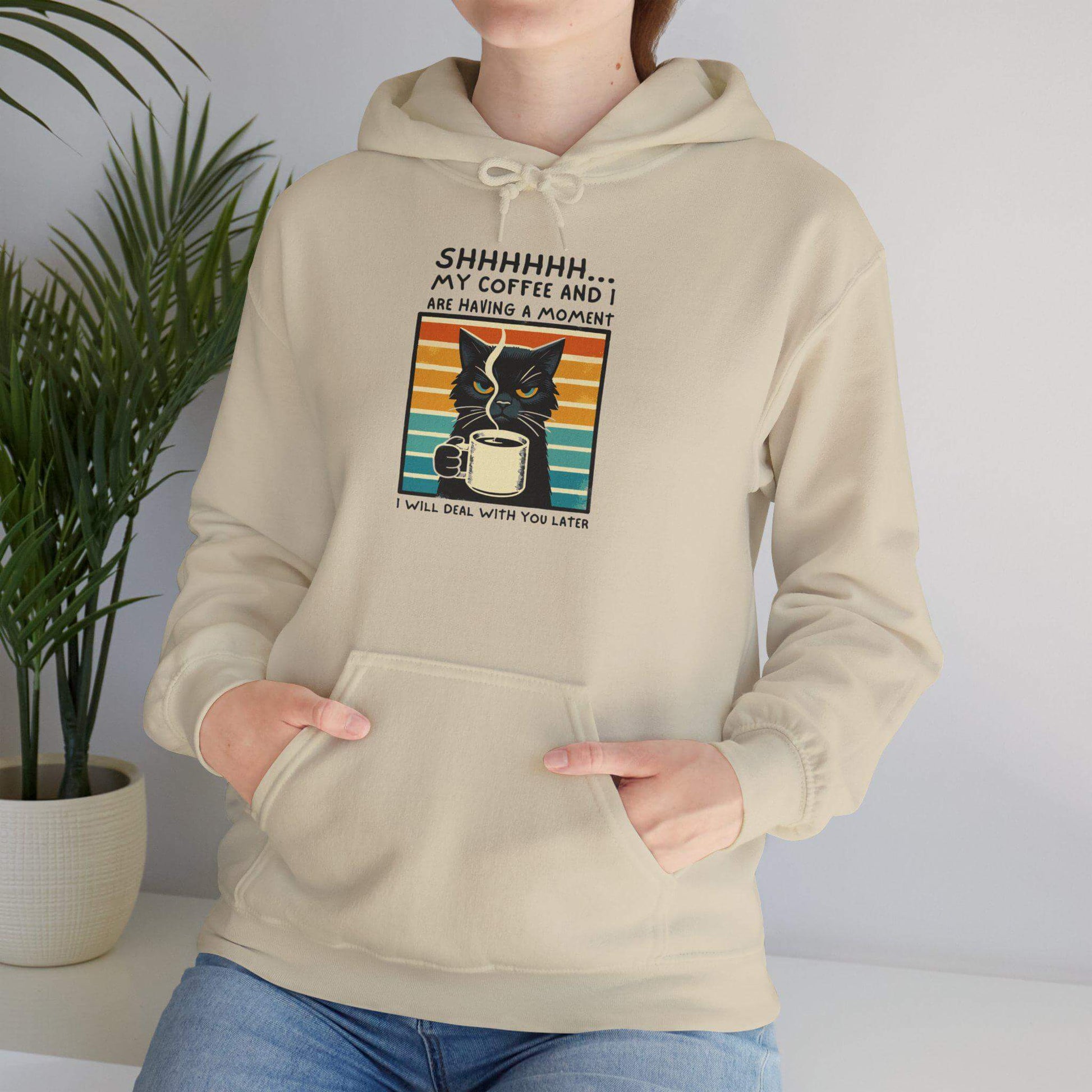 Unisex funny hoodie with cat design saying 'Shhhhhh, my coffee and I are having a moment', ideal for cozy warmth.