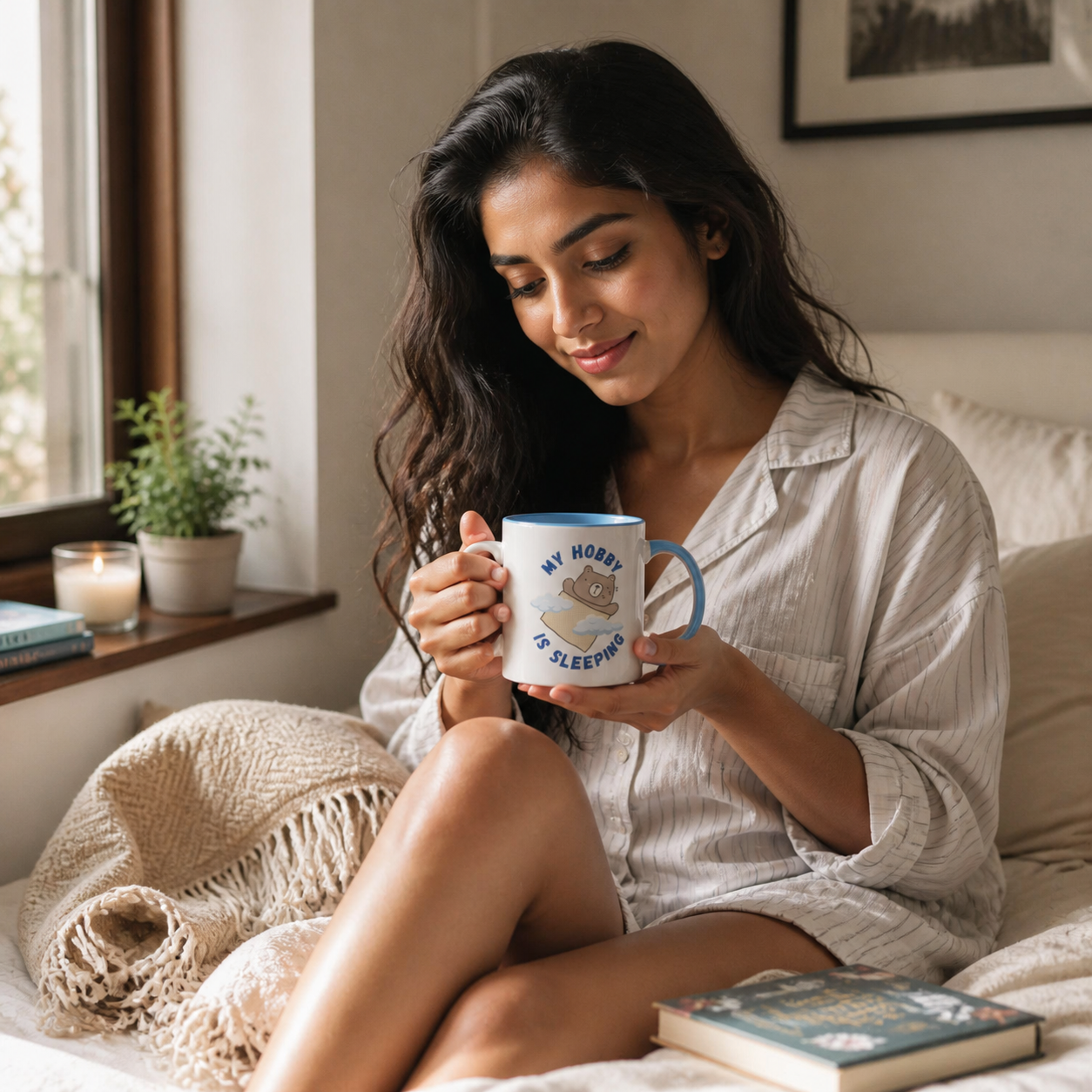 Young woman holding light-blue-accent My Hobby Is Sleeping mug in a cozy bedroom