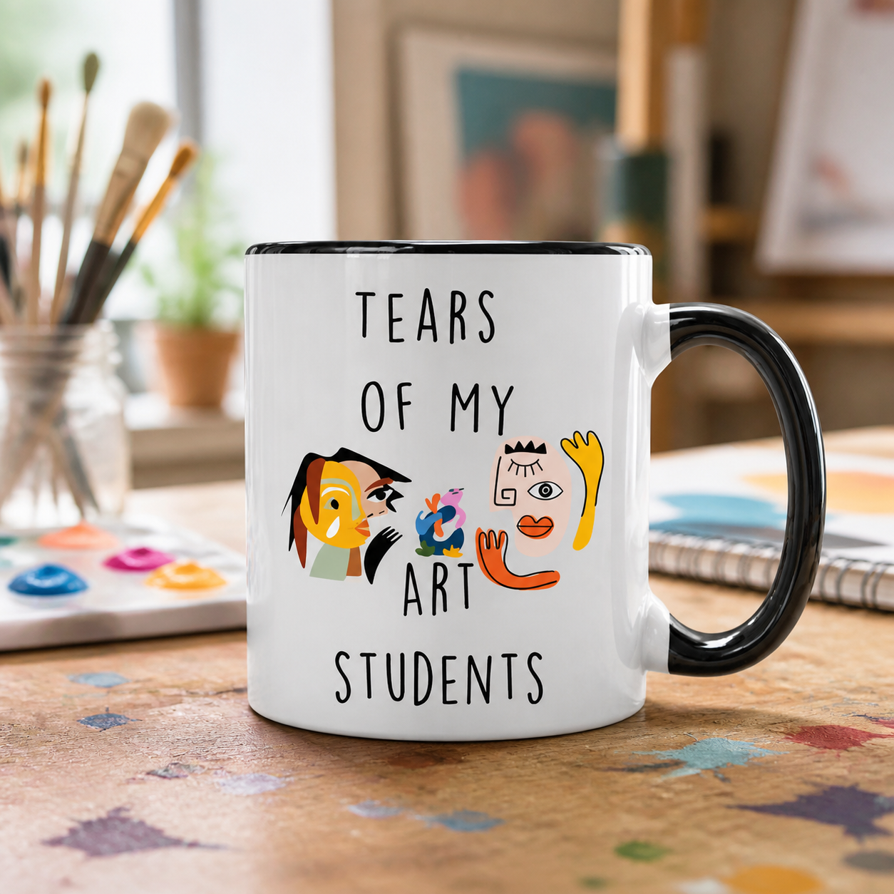Tears of My Art Students black accent mug in a creative studio setting