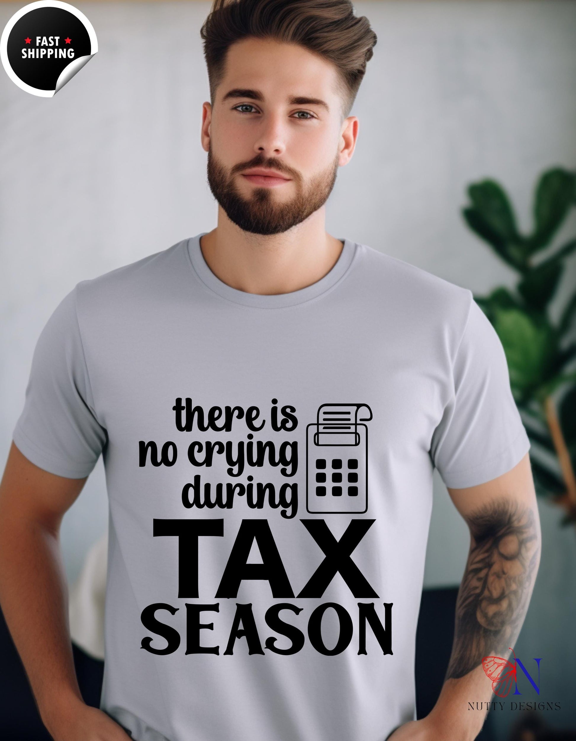 a man wearing a t - shirt that says there is no crying during tax season