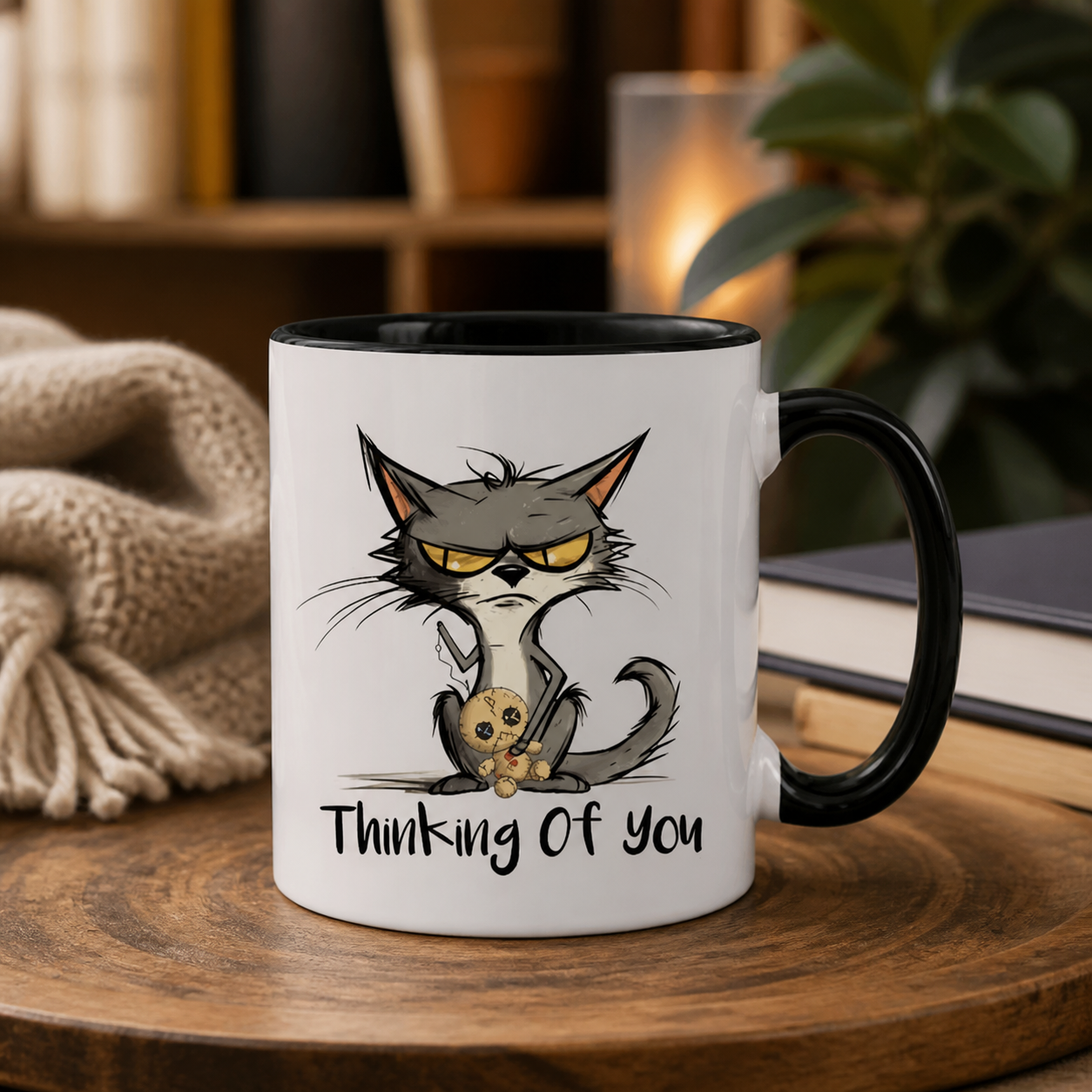 Thinking of You grumpy cat black accent mug in a cozy setting